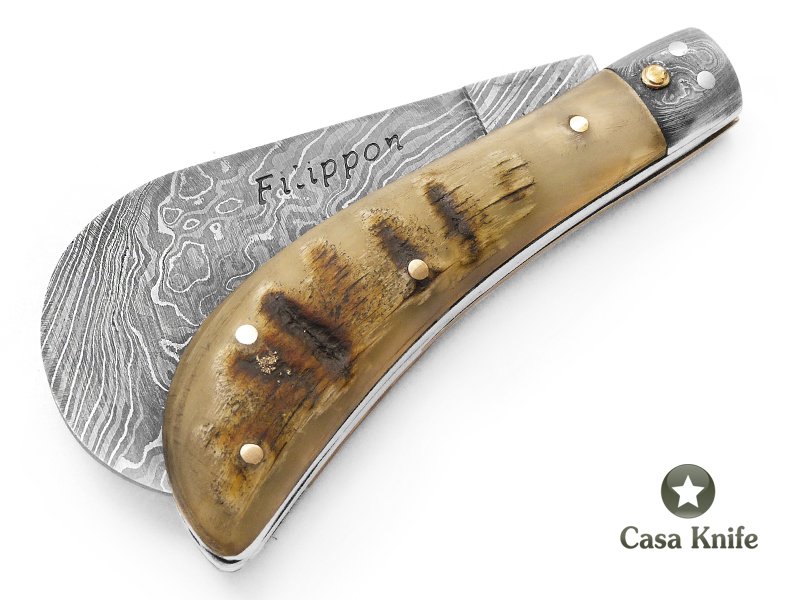Adelar Filippon Britola para colecionador em aço damasco com empunhadura em chifre de carneiro 18 cm