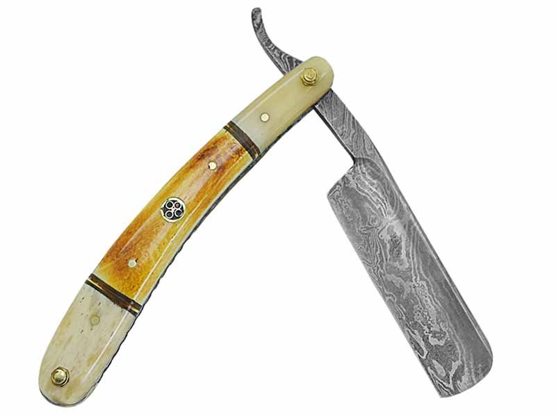 Navalha para colecionador forjada em aço damasco. Empunhadura em osso de boi, 25 cm